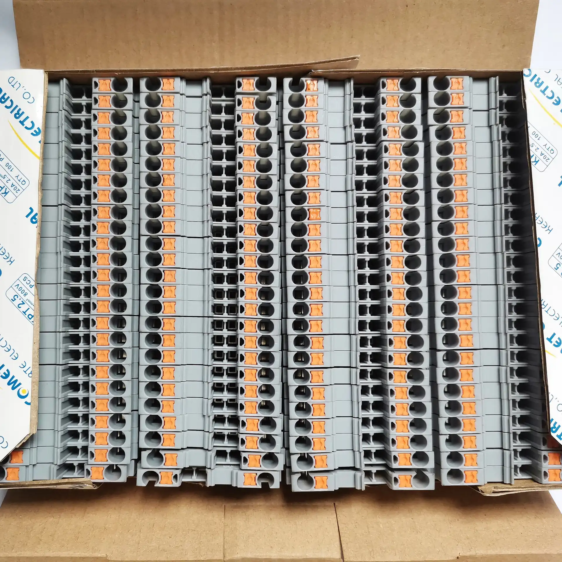 DIN rail terminal blocks organized for quality inspection and packaging