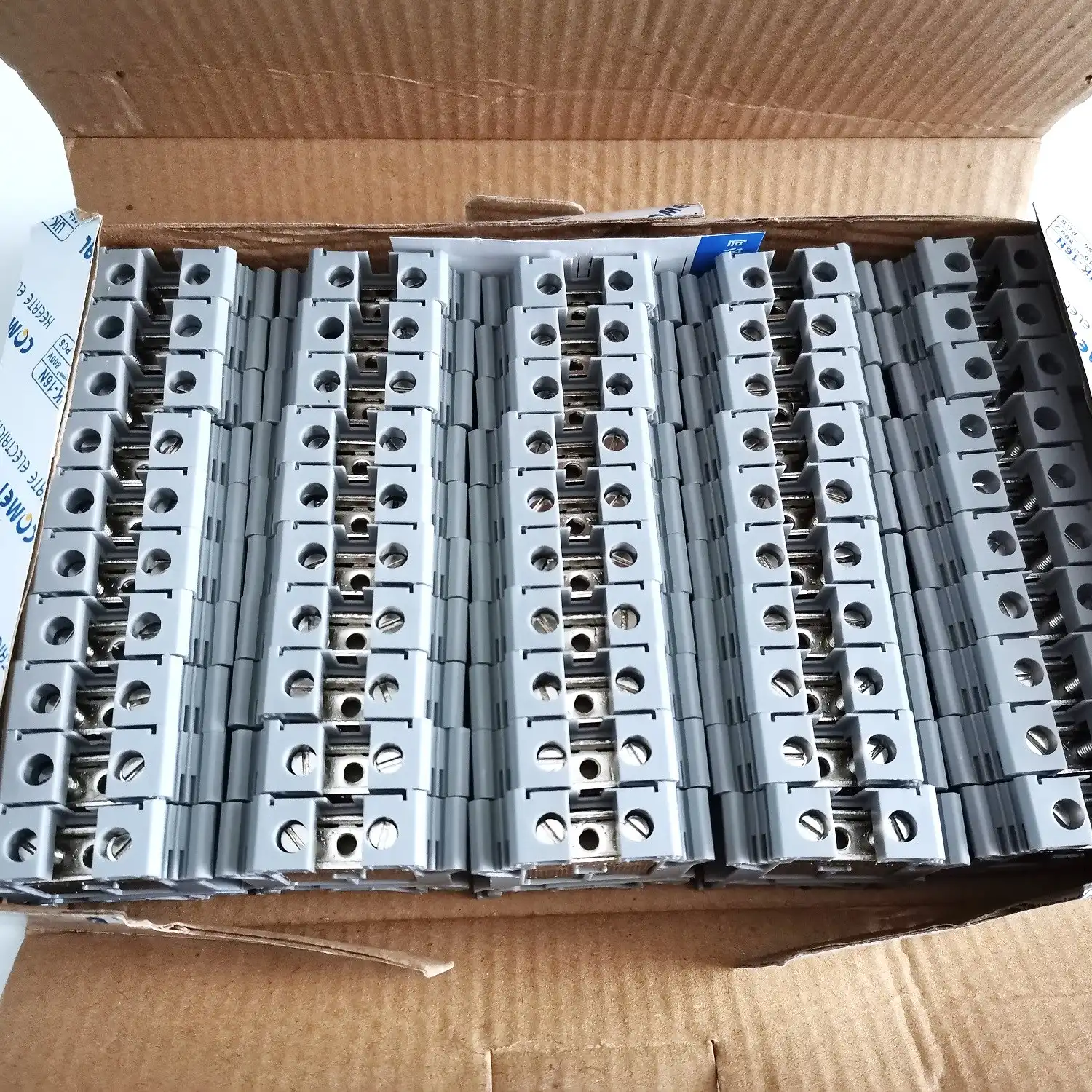 Terminal blocks and DIN rail accessories organized for shipment